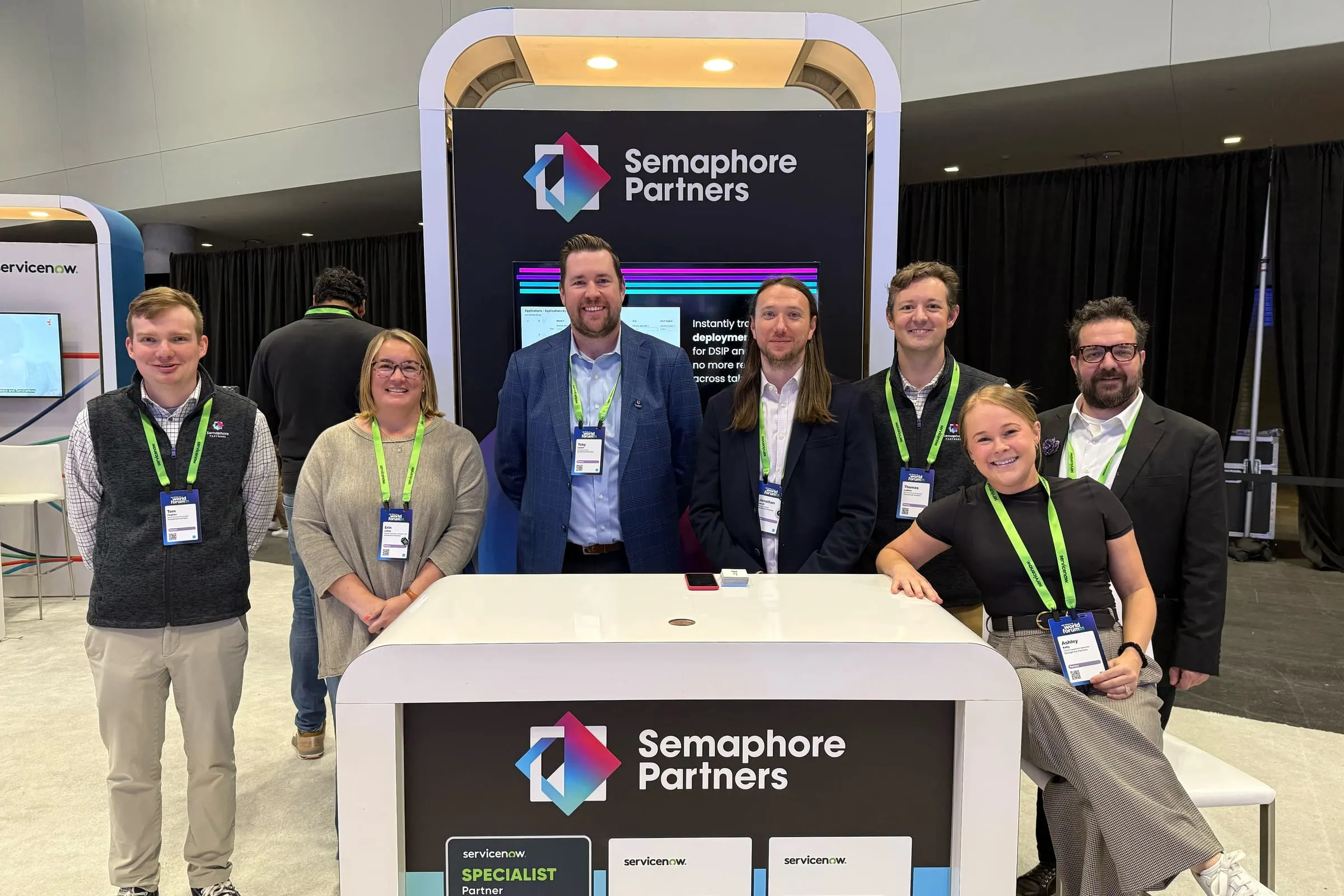 Seven Semaphore Partners team members at the Semaphore booth at ServiceNow World Forum 2025